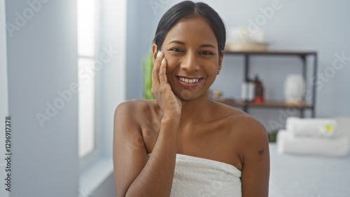 Young woman smiling indoors in a bright wellness spa showing a relaxing moment with a clean, fresh look that exudes beauty and confidence Free Download Young woman smiling indoors in a bright wellness spa showing a relaxing moment with a clean, fresh look that exudes beauty and confidence - GFXLoad