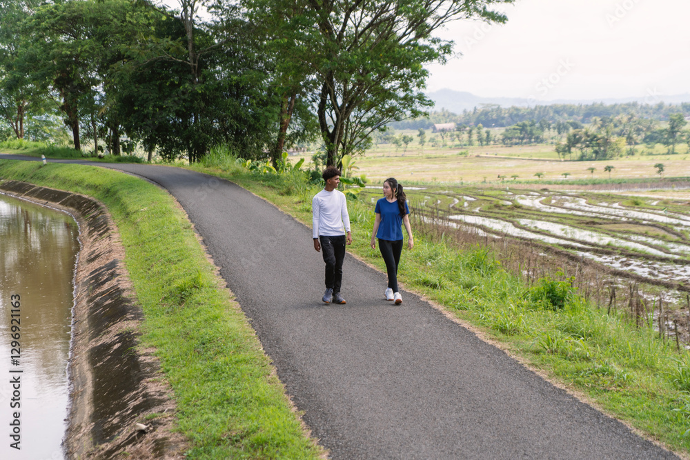 Fototapeta premium active young asian couple walking exercise at rural area