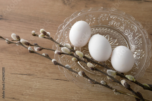 Fresh farm eggs in carton box on wooden table. Eggs in egg boxes