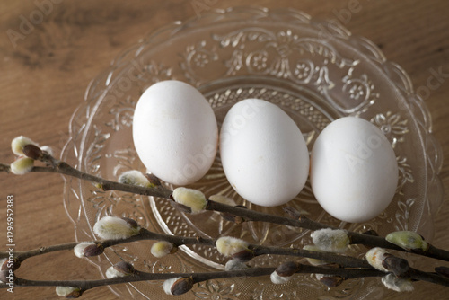 Fresh farm eggs in carton box on wooden table. Eggs in egg boxes