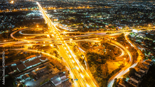 Fototapeta Naklejka Na Ścianę i Meble -  Expressway top view, Road traffic an important infrastructure, Drone aerial view fly in circle, traffic transportation, Public transport or commuter city life concept of economic and energ, transport.