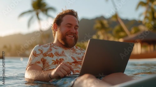 A man working on his laptop while relaxing on a beach at sunset, blending work and leisure in a tropical paradise. This image is ideal for content related to remote work, digital nomad lifestyle, and 