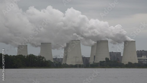 Massive air pollution in Eastern Germany, coal fired power station billowing smoke from cooling towers
