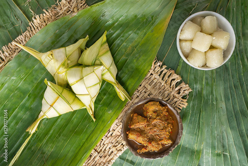 Eid Celebration Concept - ketupat and rendang with copy space background. photo