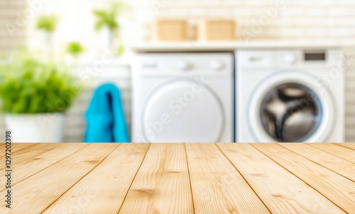 Empty wooden table in laundry room with washer and dryer