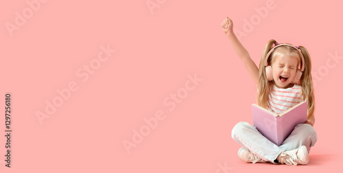 Cute little girl in headpho...