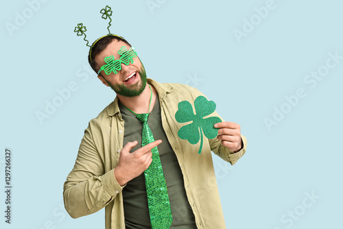 Happy young man with green ...