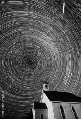 Obraz na płótnie Star trails rotating over a country church at night w salonie