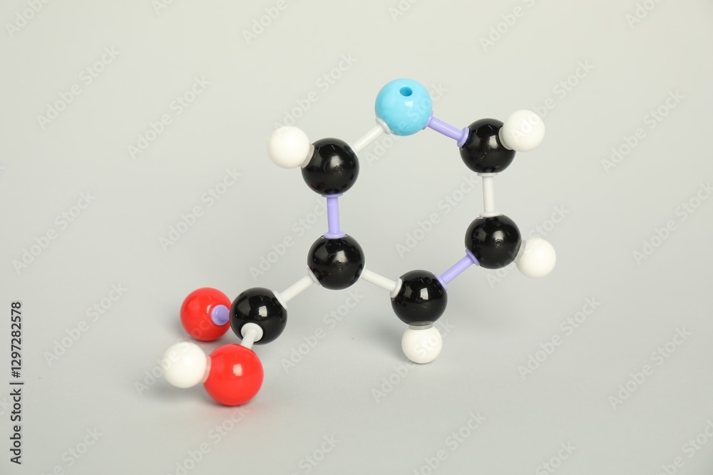 Molecule of niacin (vitamin B3) on light grey background. Chemical model Molecule of niacin (vitamin B3) on light grey background. Chemical model