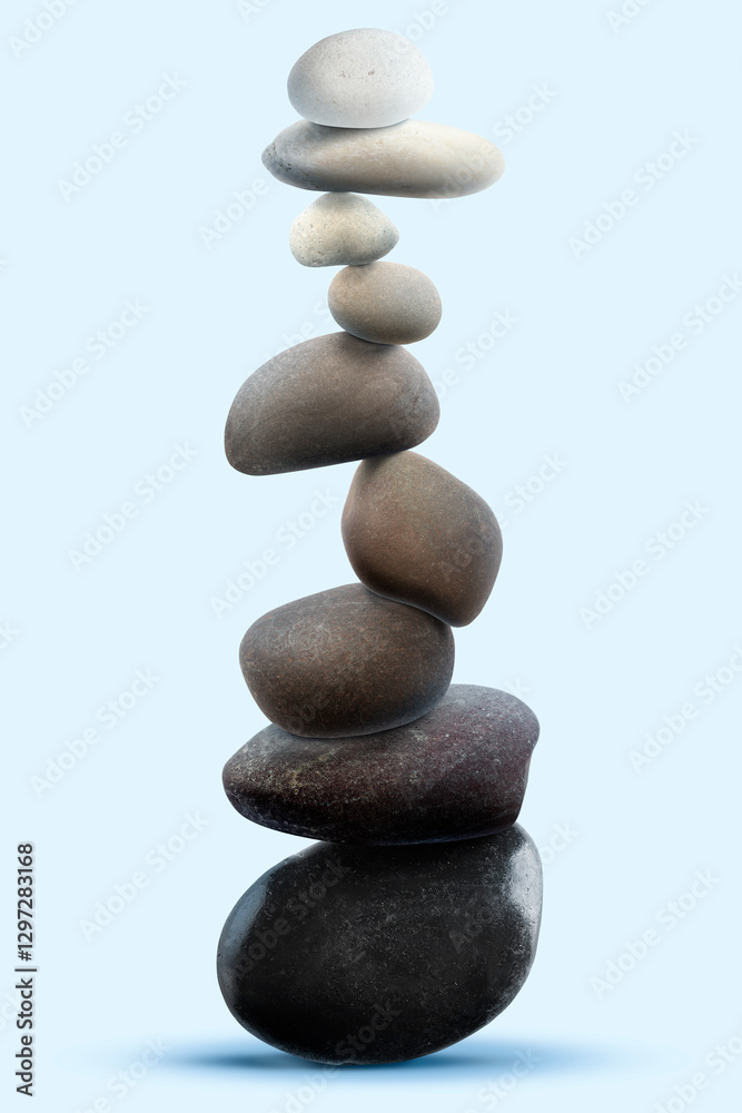 Balance shown as stacked stones on light blue background Balance shown as stacked stones on light blue background