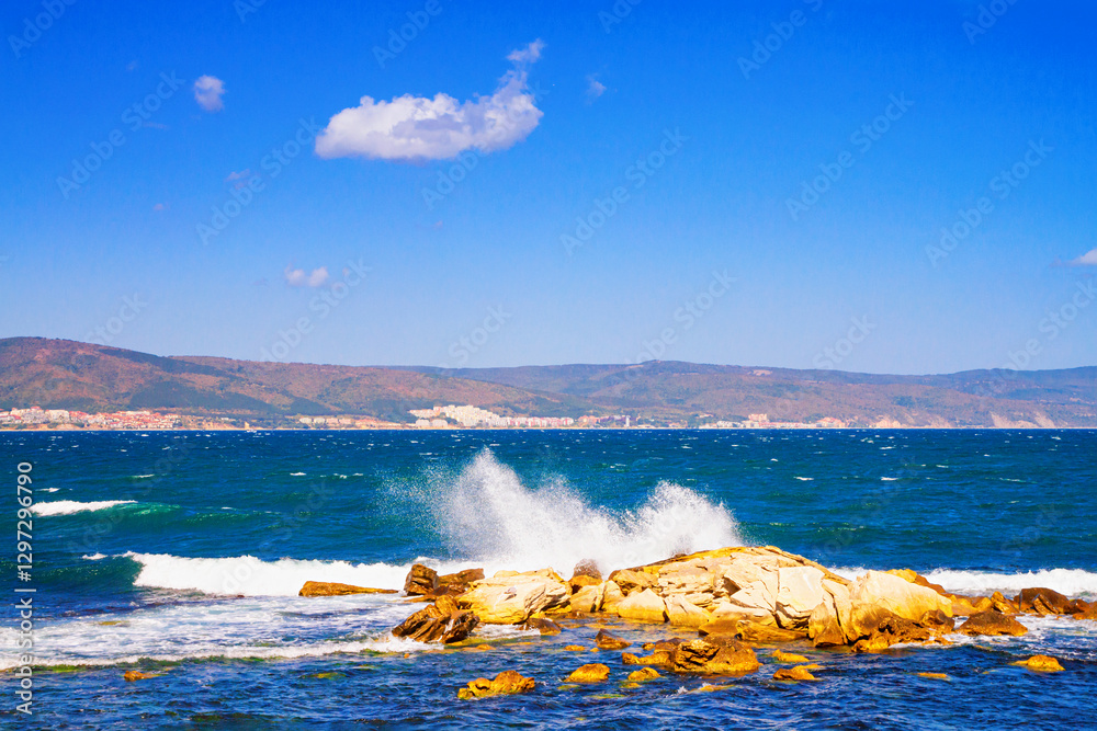 Seaside landscape - vew of the shore with waves crashing about coastal rocks, in Nessebar on the Black Sea coast of Bulgaria
