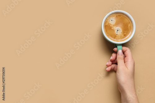 Female hand with cup of cof...