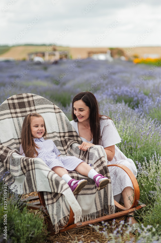 Happy family in flower field. young beautiful mother and child Girl enjoy walking blooming meadow on summer day. Dad having fun with pretty daughter in nature on sunset. mothers day. Happy family in flower field. young beautiful mother and child Girl enjoy walking blooming meadow on summer day. Dad having fun with pretty daughter in nature on sunset. mothers day.