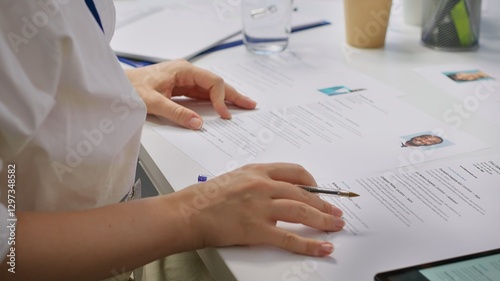 Tableau sur toile HR staff going through the selection process phase of the recruitment activity, choosing the best applicant based on their qualifications in the resume