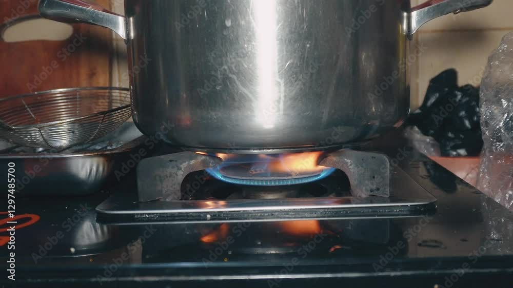 pan on gas stove, stainless steel pan on stove, cooking on gas stove
