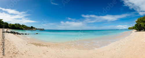 Tobago beach front panorama I love heart sign written sand