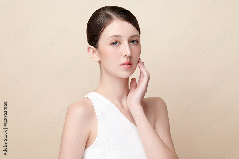 Beautiful young woman with clean fresh skin on beige background, Face care, Facial treatment, Cosmetology, beauty and spa, women portrait. Beautiful young woman with clean fresh skin on beige background, Face care, Facial treatment, Cosmetology, beauty and spa, women portrait.