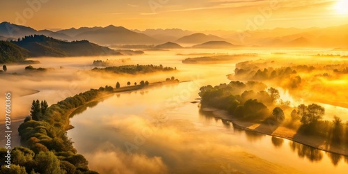Soft golden light illuminates misty dawn on vast Yellow River landscape in Sichuan Province China, Sichuan Province, sunrise yellow river misty dawn china Sichuan Province landscape nature
