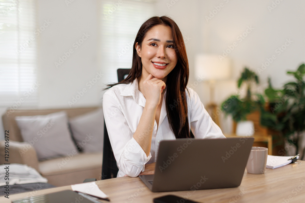 Successful business asian woman using laptop, working in home office. Business technology corporate concept.
