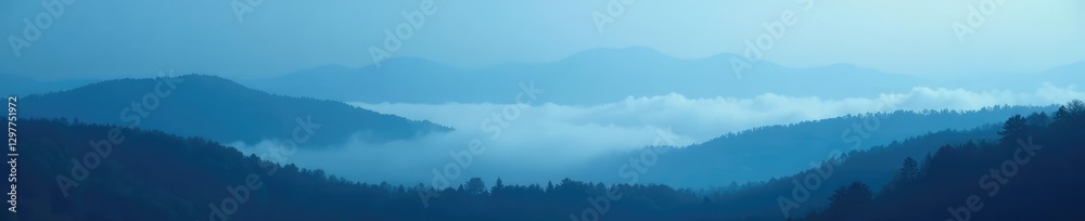 Fototapeta premium A dense fog rolling in over a blue black grainy landscape, nature, landscape