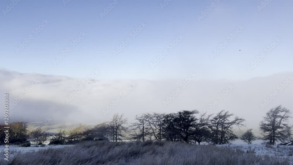 Cold morning hike in Brecon Beacons, Wales with mist and stunning views in February Cold morning hike in Brecon Beacons, Wales with mist and stunning views in February