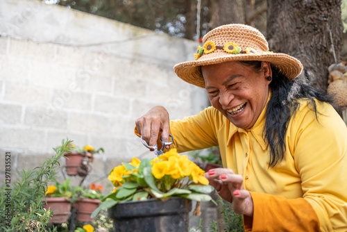 60 year old Mexican woman enjoying taking care of her garden