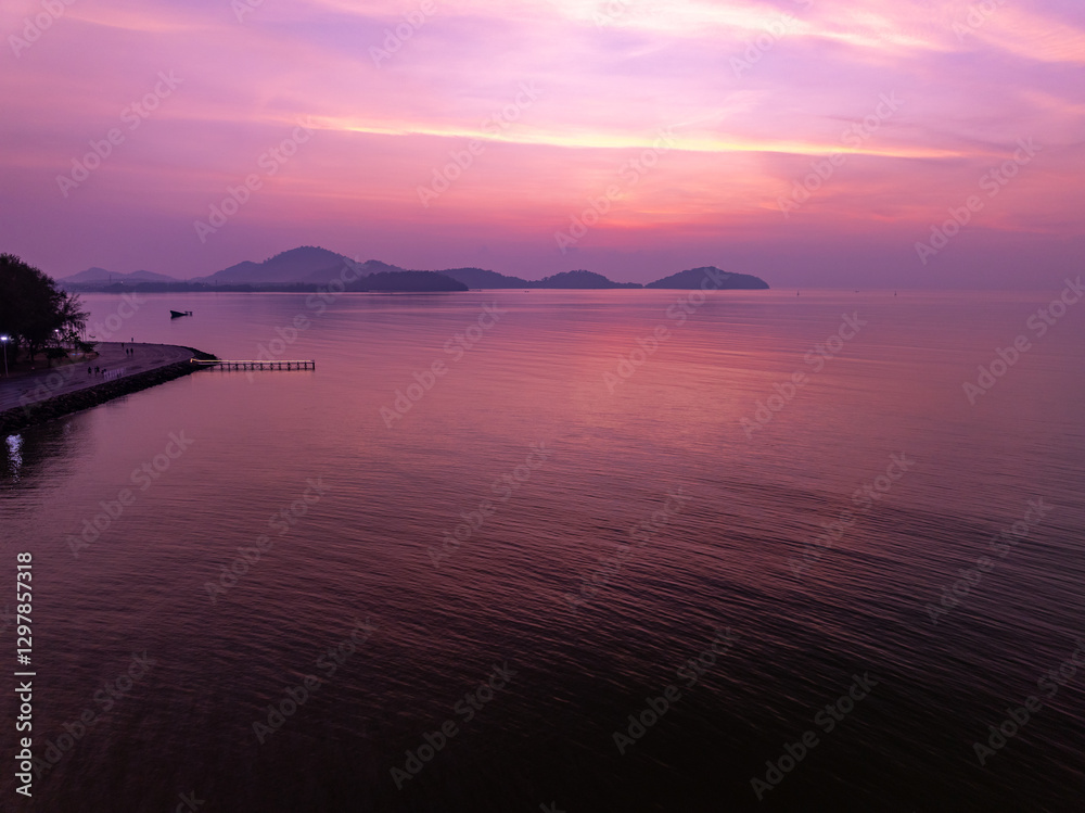Fototapeta premium Colorful sunset or sunrise sky clouds over sea in Thailand, Amazing nature landscape seascape,Beautiful light nature landscape colorful sky background