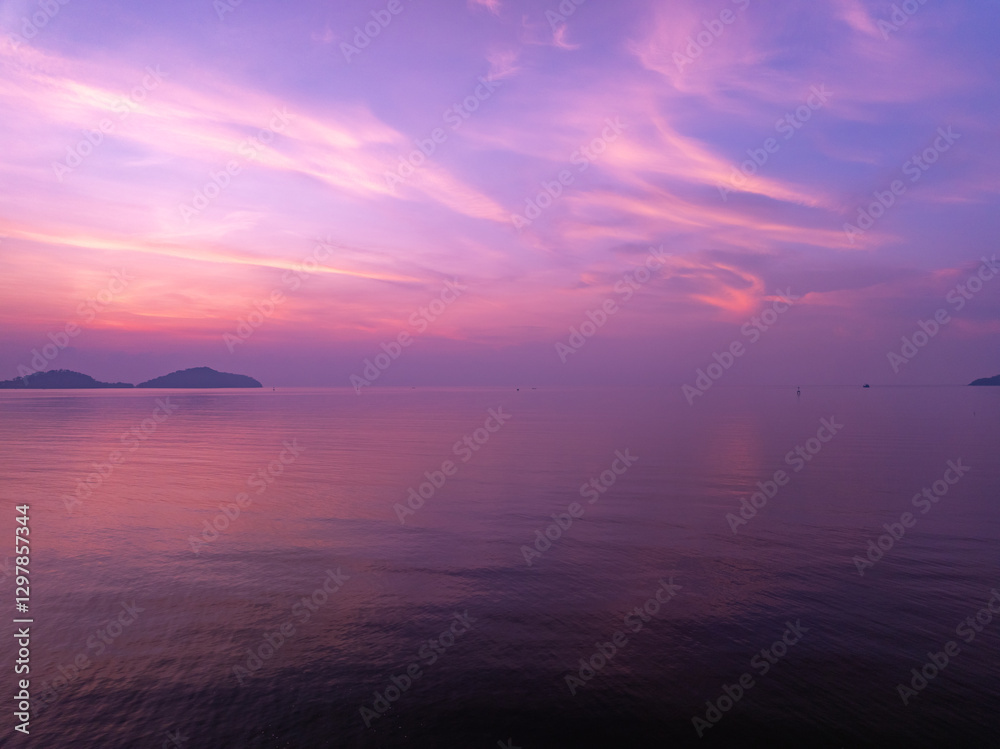 Naklejka premium Colorful sunset or sunrise sky clouds over sea in Thailand, Amazing nature landscape seascape,Beautiful light nature landscape colorful sky background
