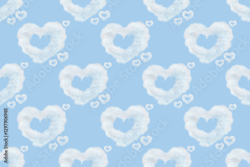 Seamless pattern of heart shaped clouds. Background of watercolor clouds on a blue sky.