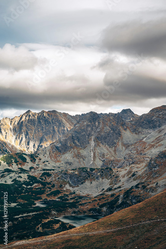 Fototapeta Naklejka Na Ścianę i Meble -  Rugged Mountain Landscape Under Cloudy Sky