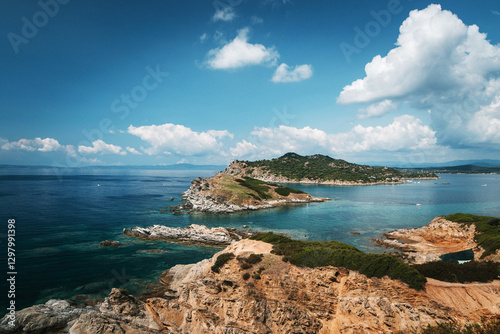 Scenic Coastal Landscape with Rocky Cliffs and Blue Sea photo