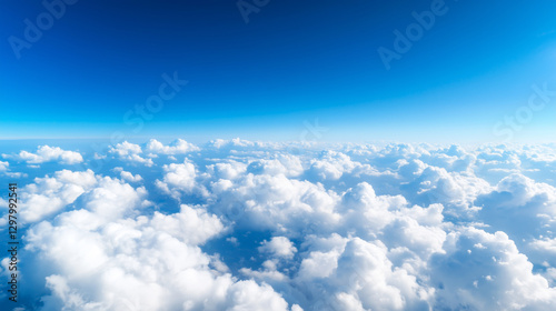 Fototapeta Naklejka Na Ścianę i Meble -  A breathtaking view of a beautiful blue sky with fluffy white clouds, as seen from an airplane window, capturing the serene and vast atmosphere above the earth. sky view from airpl