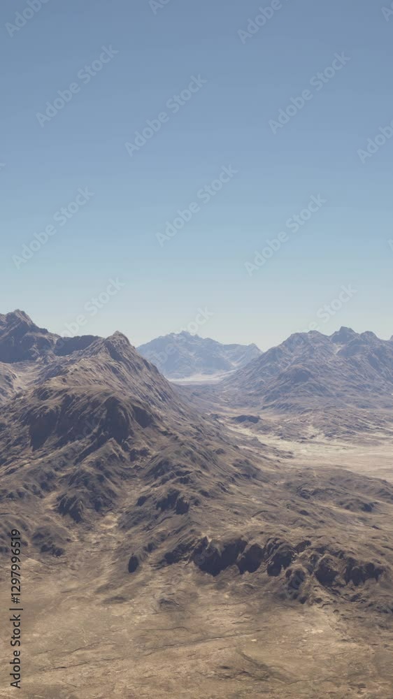 A breathtaking aerial view of a majestic mountain range in the expansive desert landscape A breathtaking aerial view of a majestic mountain range in the expansive desert landscape