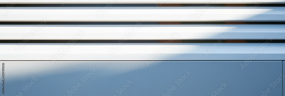 Fototapeta premium Light and shadow play on modern architectural elements in a minimalistic design