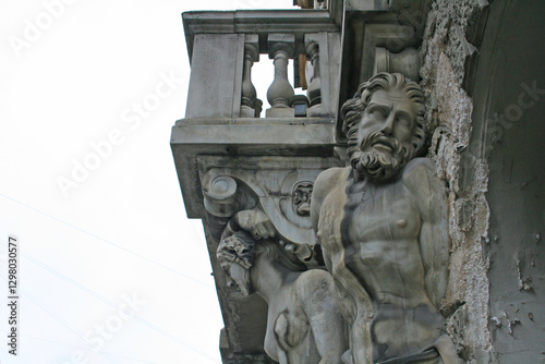 historic building with beautiful statues in need of renovation, saint petersburg, russia