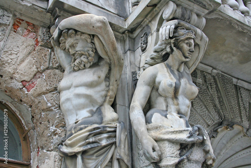 historic building with beautiful statues in need of renovation, saint petersburg, russia