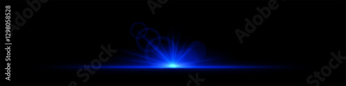 Glowing blue light burst on a dark background. Bright neon explosion with radiant beams, circular bokeh, and energy flare. Abstract illumination with vibrant glow and futuristic effect.