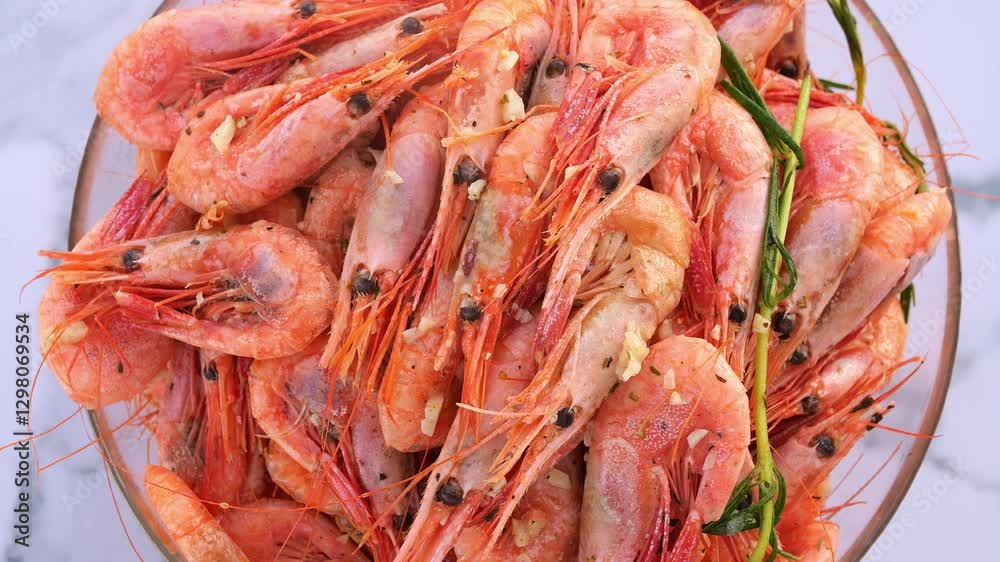 Seafood plating featuring fresh shrimp in garlic and herb sauce Highlighting seafood aroma and flavors perfect for gourmet dining or culinary inspiration Demonstration of seafood elegance and taste