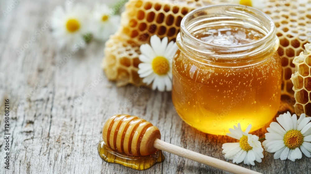 A close-up of a glass jar filled with golden honey, with a honey dipper resting beside it, surrounded by honeycomb and fresh flowers on a rustic wooden table. A close-up of a glass jar filled with golden honey, with a honey dipper resting beside it, surrounded by honeycomb and fresh flowers on a rustic wooden table.