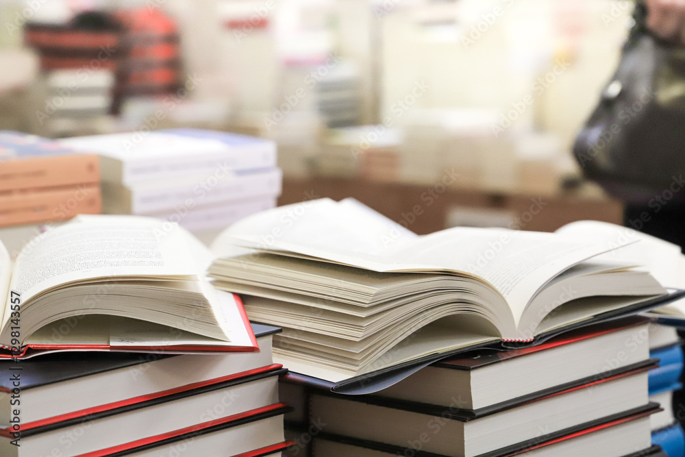 stack of books on the table. open book stack of books on the table. open book