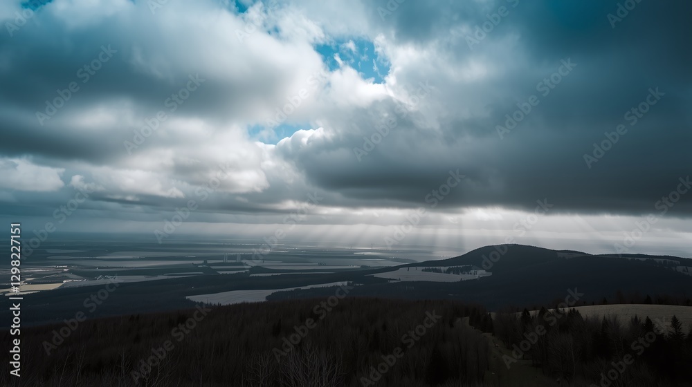 Amidst dense clouds, sunlight pierces through, illuminating vast, tranquil landscapes below. Amidst dense clouds, sunlight pierces through, illuminating vast, tranquil landscapes below.