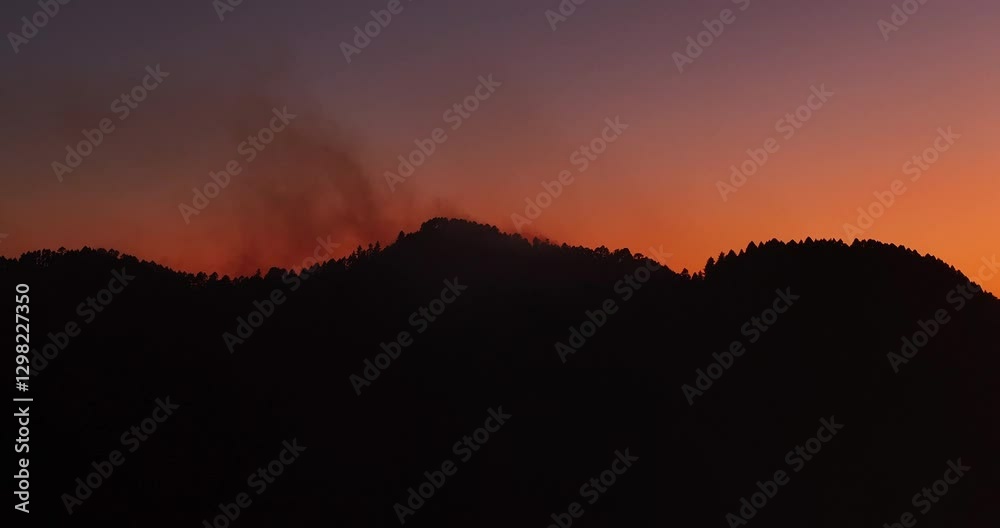 custom made wallpaper toronto digitalAERIAL: Wildfire smoke rising behind silhouette mountains, glowing evening sky