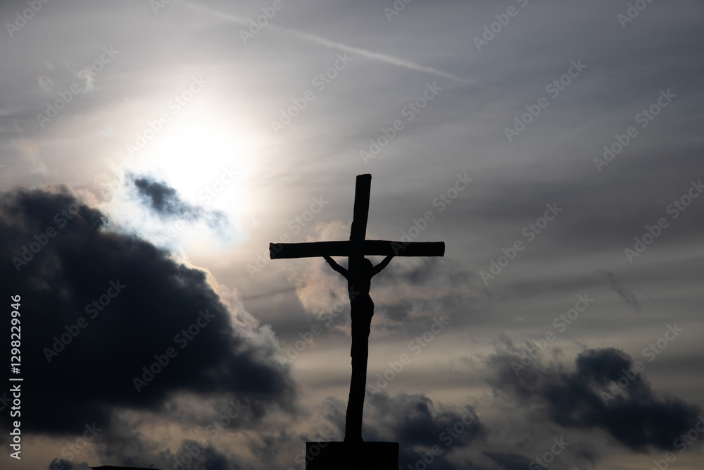 Passion Week cross silhouette with dramatic sky symbolizing the sacrifice, suffering, death, resurrection and passion of Jesus Passion Week cross silhouette with dramatic sky symbolizing the sacrifice, suffering, death, resurrection and passion of Jesus