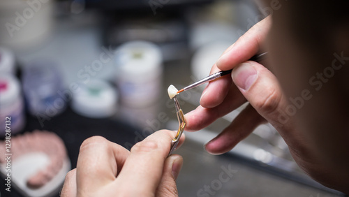 A Skilled Dental Technician Perfecting a Dental Restoration with Precision Tools in a Well-Equipped Lab Environment of Prosthetics and Cosmetic Dentistry