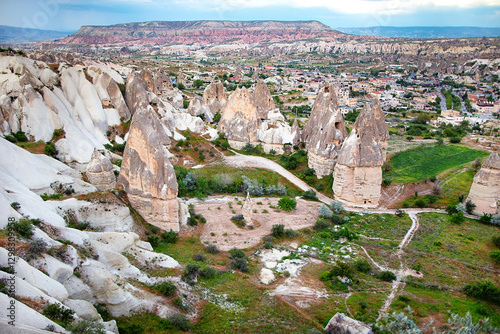 Obraz na płótnie Majestic rock formations rise above the enchanting landscape of Cappadocia at sunset. w salonie