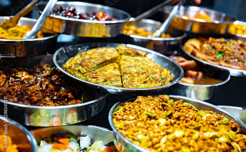 Traditional Asian dishes sold in a food court in Singapore