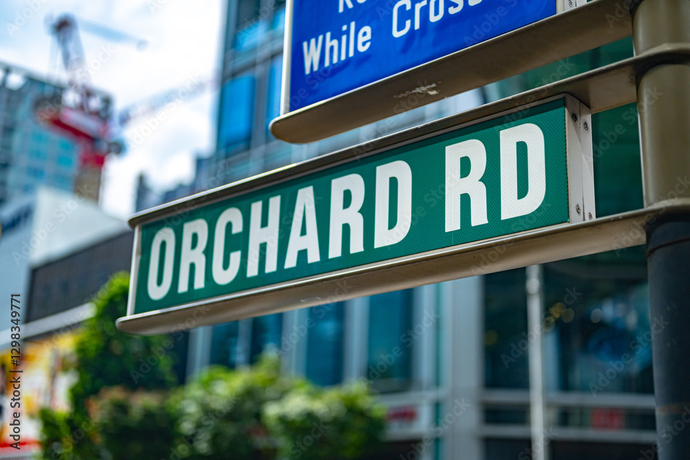 Street name sign of Orchard Road in Central Area of Singapore Street name sign of Orchard Road in Central Area of Singapore