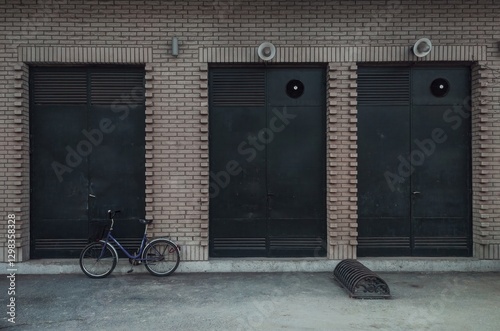 A bicycle leaning against an wall