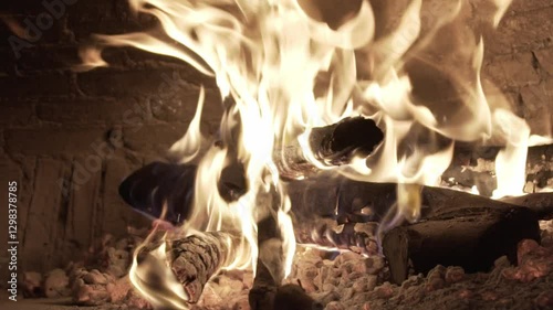 Burning woods inside a pizza stone oven (Slow Motion)