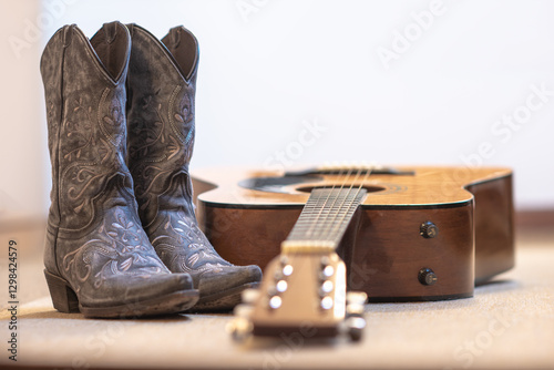 cowgirl embroidered boots and acoustic guitar - text space on top - country line dance